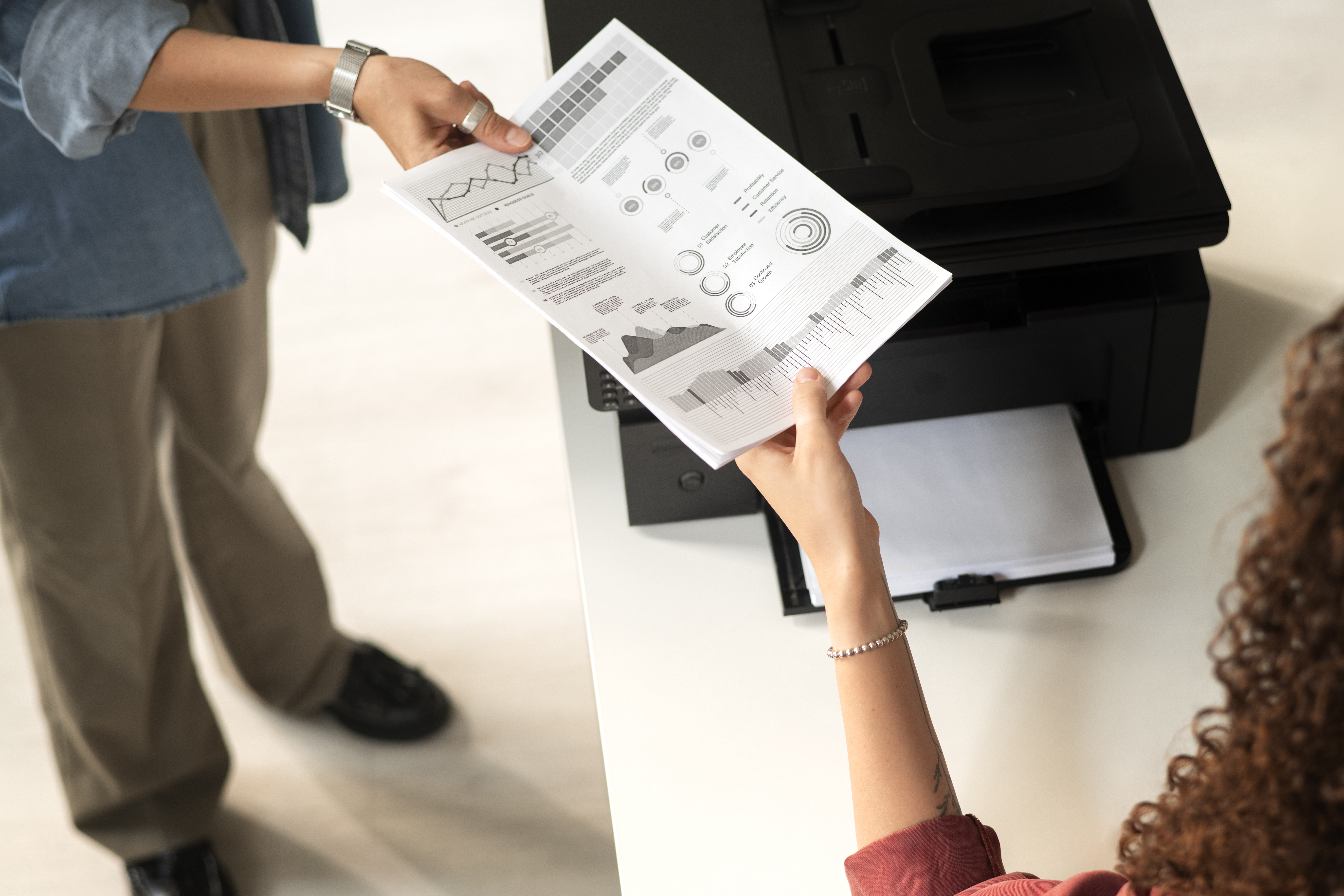 high-angle-women-holding-paper